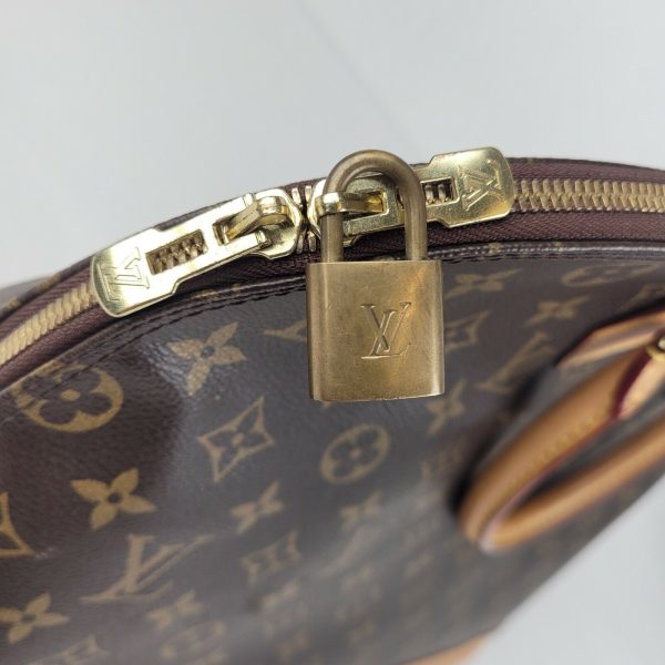 5 Louis Vuitton Alma Brown Monogram Coated Canvas Zipped Handbag