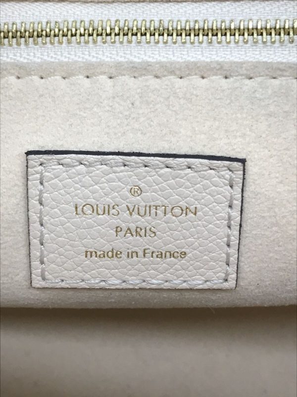 2333920402066 03 Louis Vuitton OnTheGo MM Empreinte Leather Beige