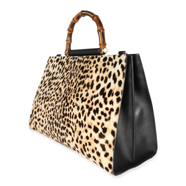 107161 sv 0f90c00b 5e54 434c 87c6 f88a2e6342c9 Gucci Leopard Printed Calf Hair Nymphaea Bamboo Top Handle Tote