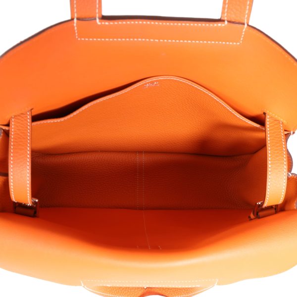 114849 av Hermès Orange Clémence Halzan 31 PHW