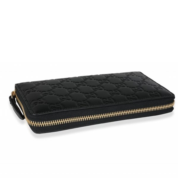 116196 clasp cd7b75f3 3d3d 4dc8 923a 147fc8de2329 Gucci Black Guccissima Zip Around Wallet