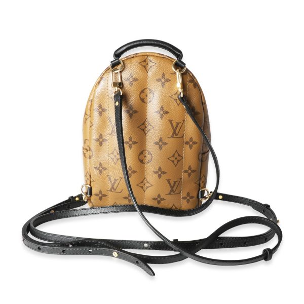 117602 pv 611297f6 ae6b 4a78 856c cb18aaacdf26 Louis Vuitton Monogram Monogram Reverse Canvas Palm Springs Mini Backpack