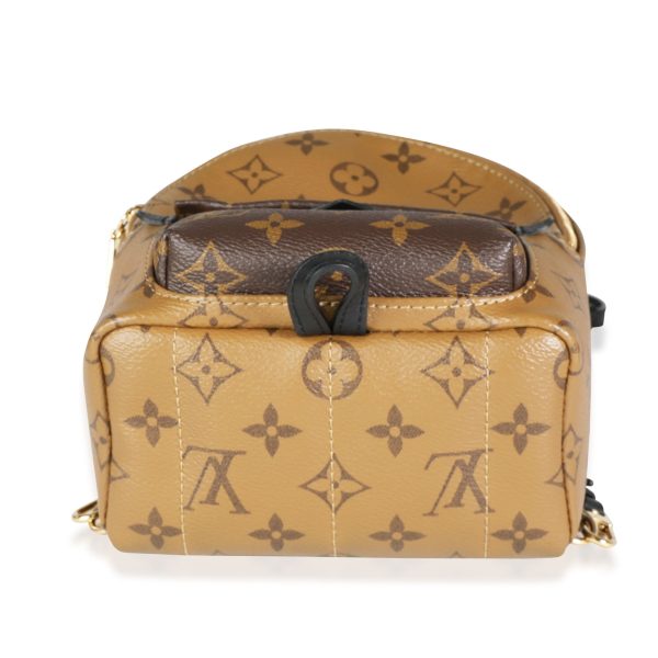 117602 stamp a5dde888 9d59 4348 b432 b66cf77a6f61 Louis Vuitton Monogram Monogram Reverse Canvas Palm Springs Mini Backpack