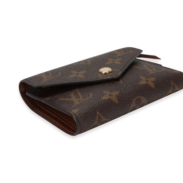 117653 clasp 0d9b15dc 5aa5 4e5a 8360 4cb839489425 Louis Vuitton Monogram Canvas Armagnac Leather Victorine Wallet