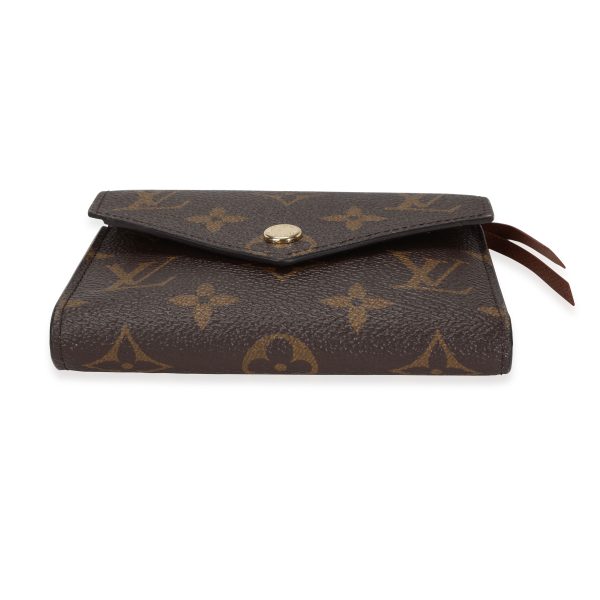 117653 stamp e7c7af50 bae7 4316 9778 5cbcf3426b32 Louis Vuitton Monogram Canvas Armagnac Leather Victorine Wallet