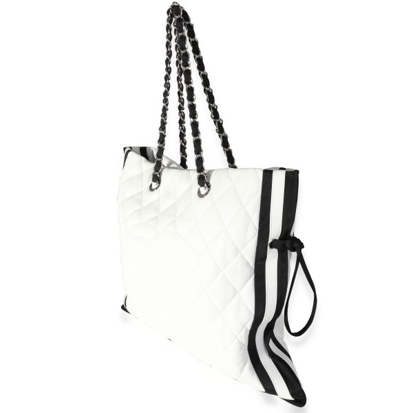 118163 sv c3d59679 b5e0 4aaf b8c1 d8ab25fe3031 Chanel White Quilted Lambskin Black Grosgrain CC Drawstring Tote