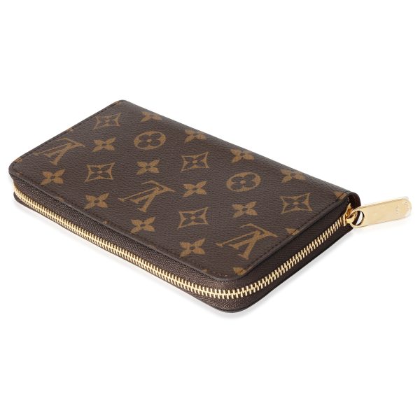 118285 stamp ef232238 84bc 4a3a 8558 a3e2d490a169 Louis Vuitton Brown Monogram Canvas Zippy Wallet