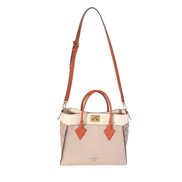 119178 bv f693e372 add7 4082 b8c1 f87c68074e51 Louis Vuitton Galet Calfskin Tufted Monogram On My Side MM Tote