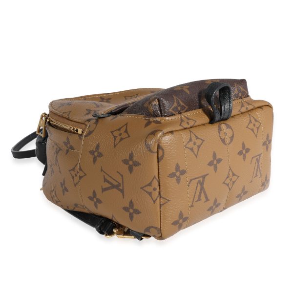 121775 clasp 1fc504c5 b5ac 44dd add8 ed805fd84d95 Louis Vuitton Monogram Reverse Palm Springs Mini Backpack