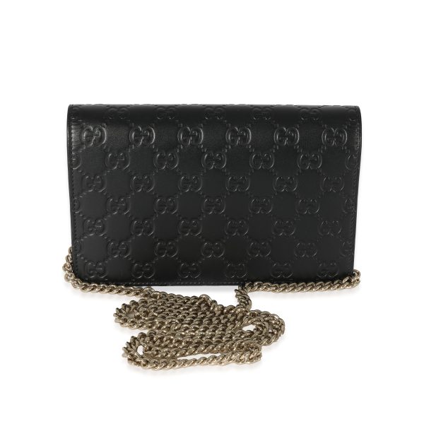 128564 stamp d6ef8b41 7670 4fa5 9983 f107489bd438 Gucci Black Leather Guccissima Bow Chain Wallet