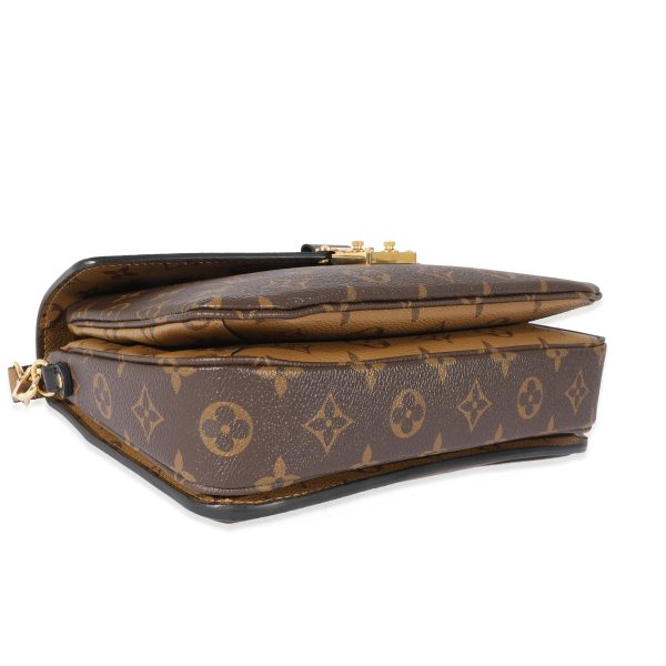 128648 clasp eea366b0 0e15 45fc b0e3 a06fed4992c8 Louis Vuitton Monogram Reverse Pochette Metis