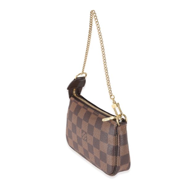 130501 sv 3fd85af5 a274 4048 bc6d 9fbf29bce294 Louis Vuitton Canvas Damier Ebene Mini Pochette