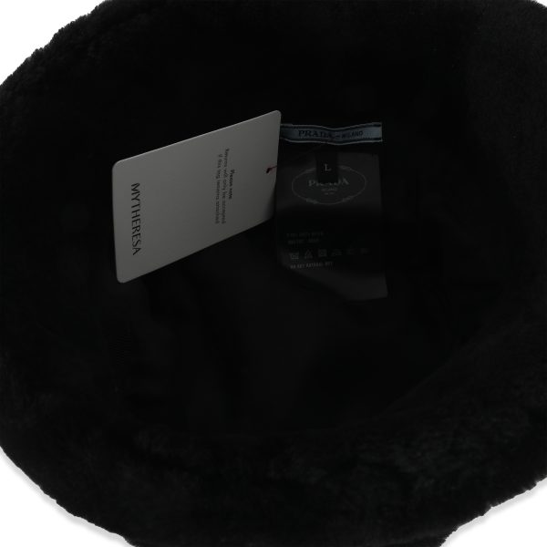 134833 stamp c6bc6eeb 860b 40a3 ba76 eddf54e0e49f Prada Black Shearling Logo Bucket Hat L