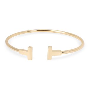 Tiffany Co Tiffany T Bangle in 18K Yellow Gold Prada Bifold Wallet Black