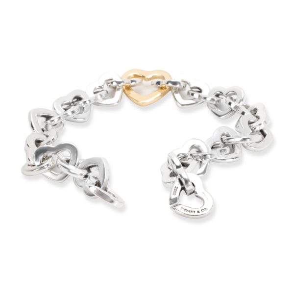 103922 bv 52b7ea6a f361 4b99 a154 eba990316f38 Tiffany Co Linked Open Hearts Bracelet in 18K Yellow Gold Sterling Silver