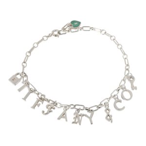 Tiffany Co Letters Charm Bracelet in Sterling Silver Louis Vuitton Handbag Vernis Tompkins Square Beige