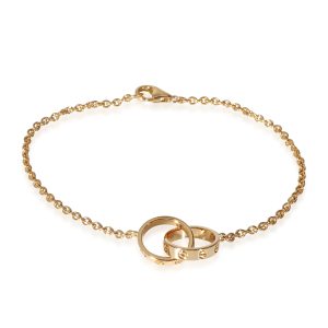 Cartier Love Interlocking Circle Bracelet in 18k Yellow Gold Louis Vuitton Portefeuille International Wallet Monogram