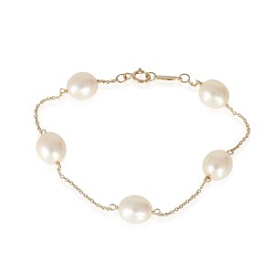 Tiffany Co Elsa Peretti Pearls by the Yard Bracelet in 18K Yellow Gold Gucci Bamboo Shoulder Bag Black