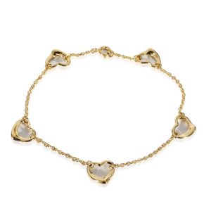 Tiffany Co Elsa Peretti Open Heart 5 Station Bracelet in 18K Yellow Gold Louis Vuitton Onthego Monogram Jacquard Tote Bag Black