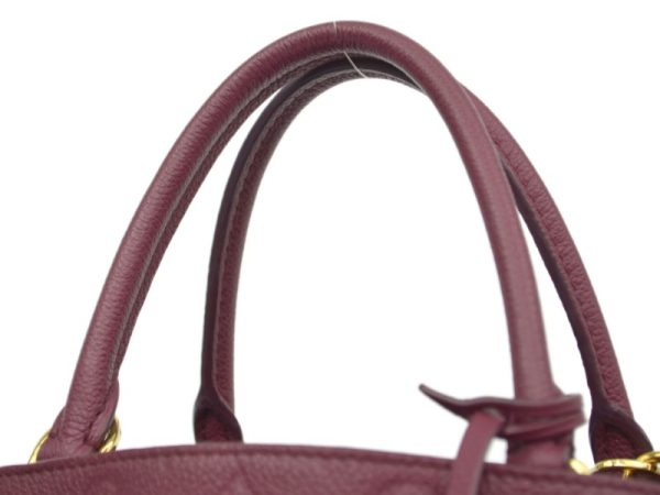 15088137 3 b Louis Vuitton Montaigne Aurore Monogram Empreinte Shoulder Bag Red