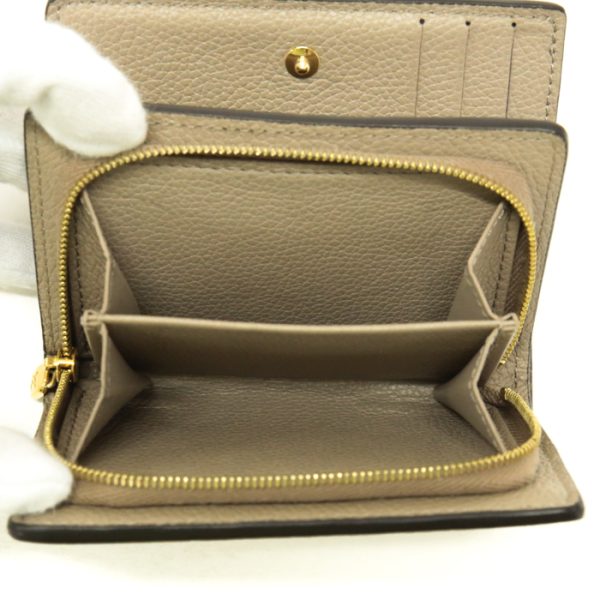 mas20011 7 Louis Vuitton Portefeuil Claire Monogram Empreinte Leather Bifold Wallet Round Zipper Medium Tourtrail Beige