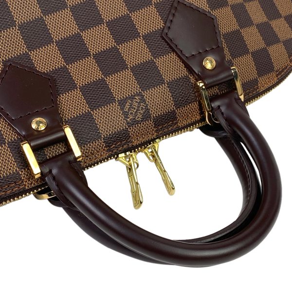 1000044353635 17 Louis Vuitton Alma Handbag Damier Brown