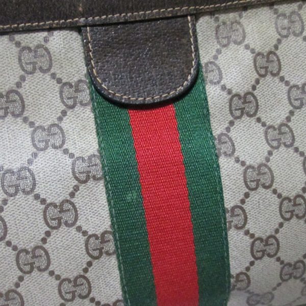 134733 4 Gucci GG Monogram Clutch Bag Wide Size