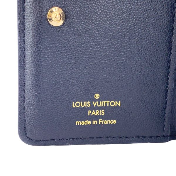 23036921 08 Louis Vuitton Lou Compact Wallet Monogram Circle Embossed Leather