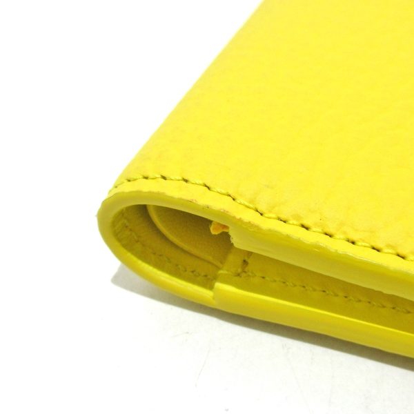 37886872 7 Louis Vuitton LV Vertical Wallet Compact Bifold Wallet Taurillon Yellow