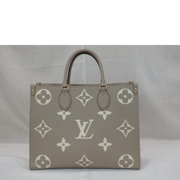 49985 2 Louis Vuitton On the Go MM Turtleneck Handbag Crème