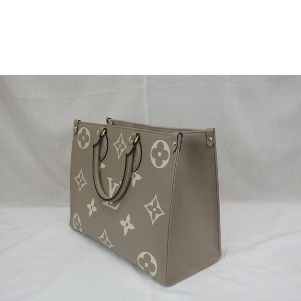 49985 3 Louis Vuitton On the Go MM Turtleneck Handbag Crème