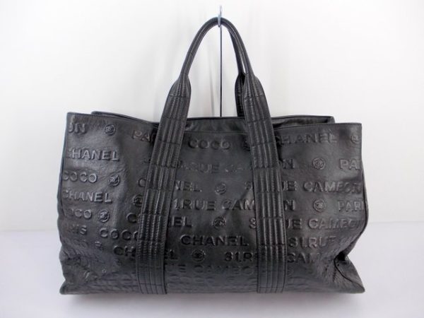 compass1717149603 Chanel Embossed Logo Tote Bag Black