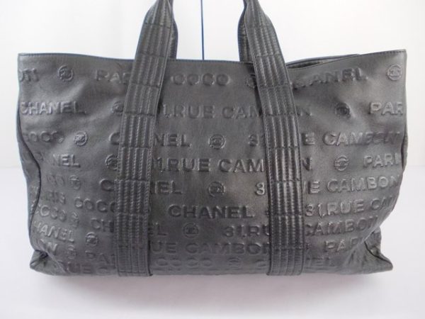 compass1717149651 Chanel Embossed Logo Tote Bag Black