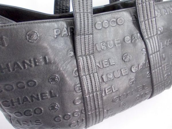 compass1717149748 Chanel Embossed Logo Tote Bag Black