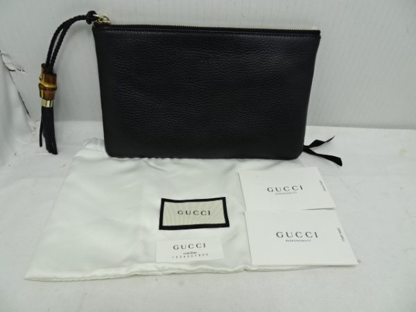 imgrc0088857780 Gucci Bamboo Tassel Clutch Bag in Bamboo Leather