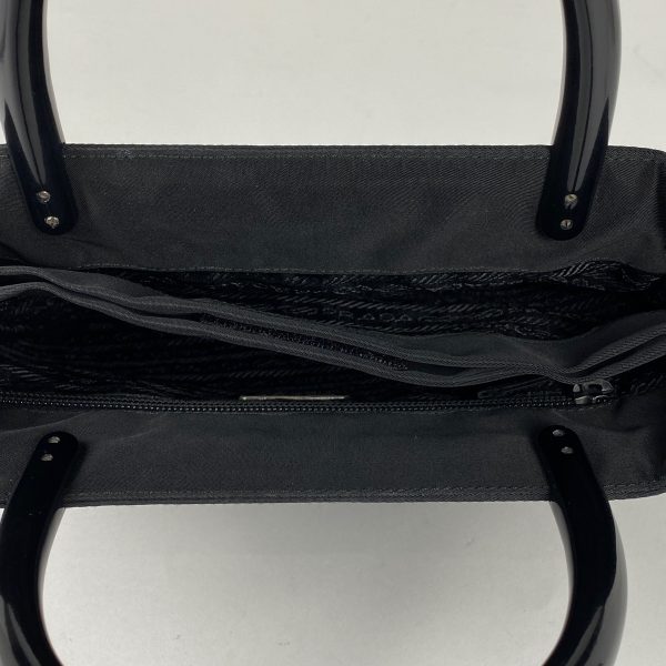 1000058487173 16 Prada Logo Plate Nylon Handbag Black