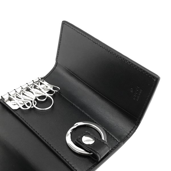 473924 cwc1n 1000 05 Gucci Key Case 6 Row Keychain Dorian GG Leather Black