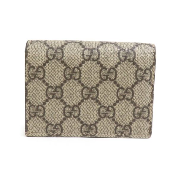 e58495 1 Gucci GG Supreme Canvas Bifold Wallet Beige