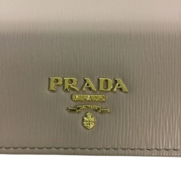 imgrc0182439546 Prada Saffiano Bifold Wallet Beige