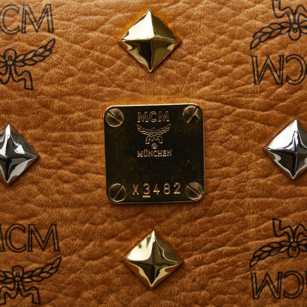 1 0137705 9 MCM Visetos Logogram Studded Clutch Bag Brown PVC Leather