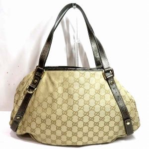 100303200a900071 1 Louis Vuitton Beach Pouch Giant Monogram Teddy Shearling Leather Beige