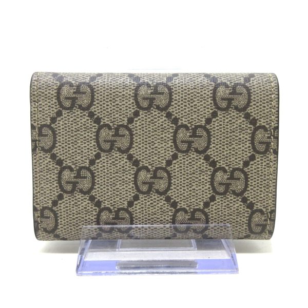 37900709 2 Gucci Gg Supreme Pvc Wallet Beige