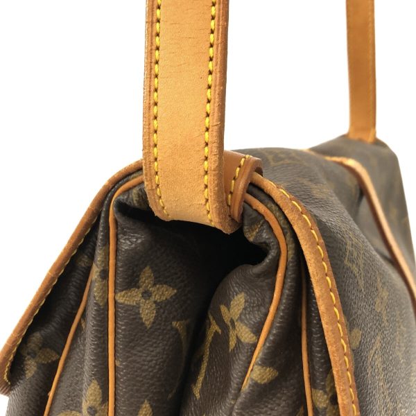 38249604 10 Louis Vuitton Saumur Monogram Canvas Shoulder Bag Brown