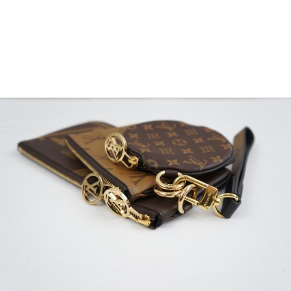 70805 3 Louis Vuitton Pochette Trio Monogram Giant Reverse Brown