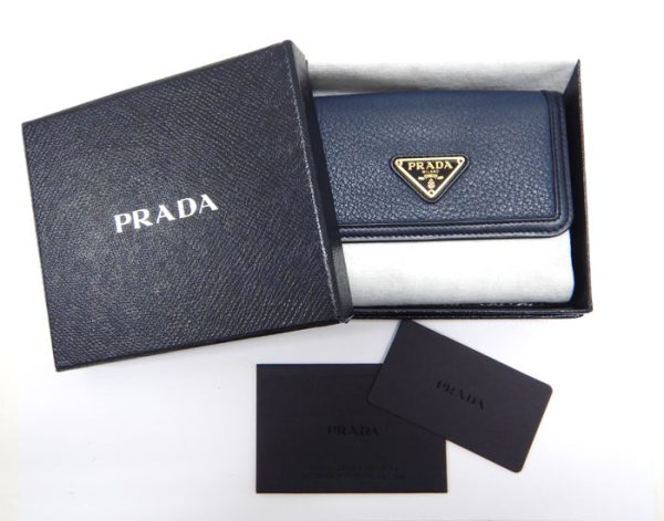 imgrc0093315235 Prada Saffiano Triangle Plate Trifold Wallet Navy