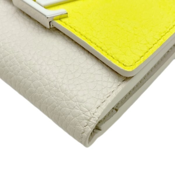 created by Background Eraser LOUIS VUITTON Portefeuille Capucines XS Jaune Fluot Coquine Yellow