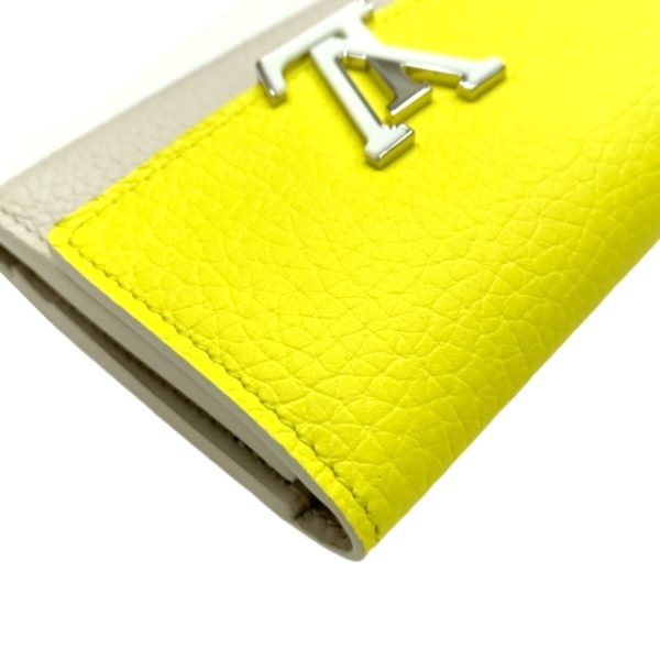 created by Background Eraser LOUIS VUITTON Portefeuille Capucines XS Jaune Fluot Coquine Yellow