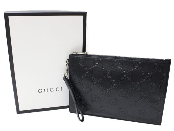 imgrc0096920625 Gucci GG Embossed Clutch Bag Leather Black