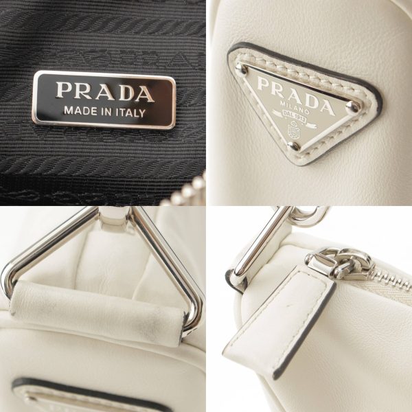 re pra sh w 00191 6 Prada Logo Embossed Triangle Leather Shoulder Bag White