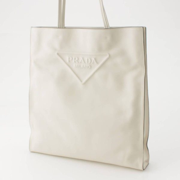 re pra to w 00197 1 Prada Triangle Leather Embossed Tote Bag White